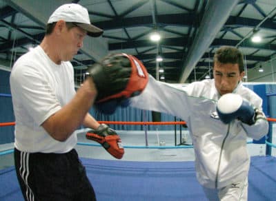 Termite trains Iraqi boxer Najah Ali for the 2004 Summer Olympics. (Joe Klamar/AFP via Getty Images)