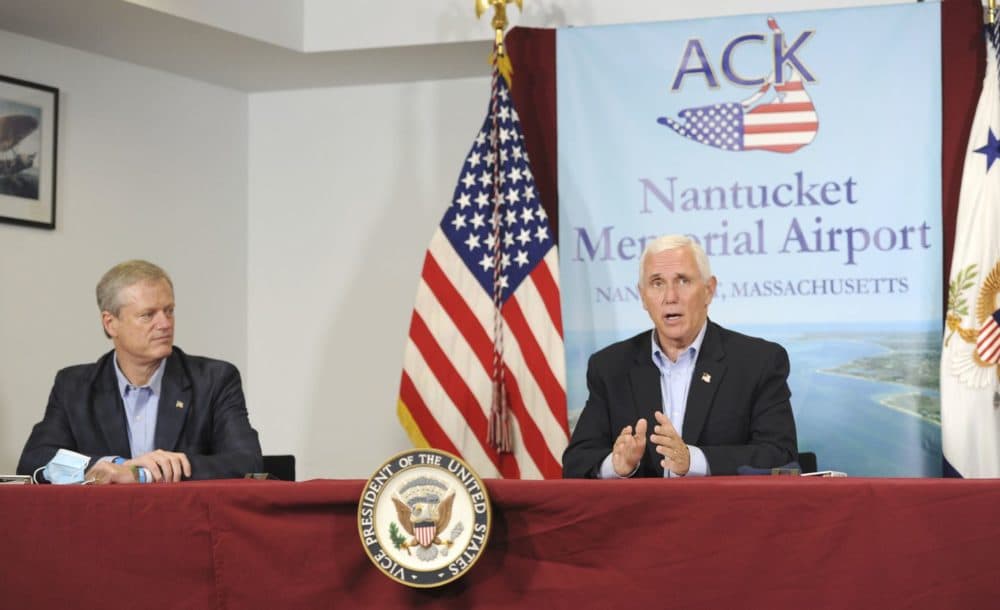 Gov. Charles Baker listens to Vice President Michael Pence speak about the federal response to the COVID-19 pandemic in Nantucket on Saturday afternoon. Pence visited Nantucket for a campaign fundraising event. (Merrily Cassidy /Cape Cod Times/AP)
