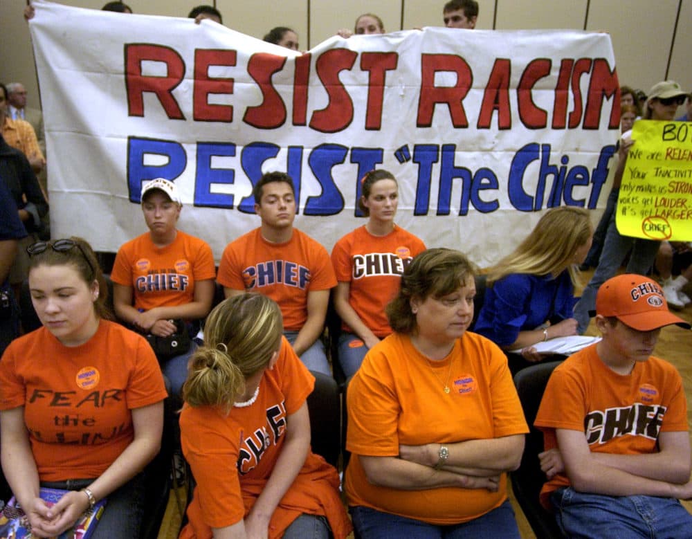 Supporters and opponents of University of Illinois' mascot listen at a board of trustees meeting Thursday, June 17, 2004 in Chicago. (M. Spencer Green/AP)