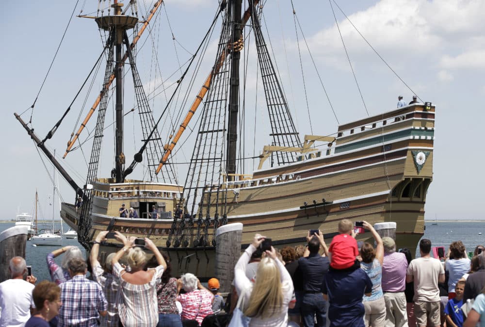In this June 6, 2016 file photo, people on a wharf watch as the Mayflower II arrives in Plymouth Harbor in Plymouth, Mass. (Steven Senne/AP)