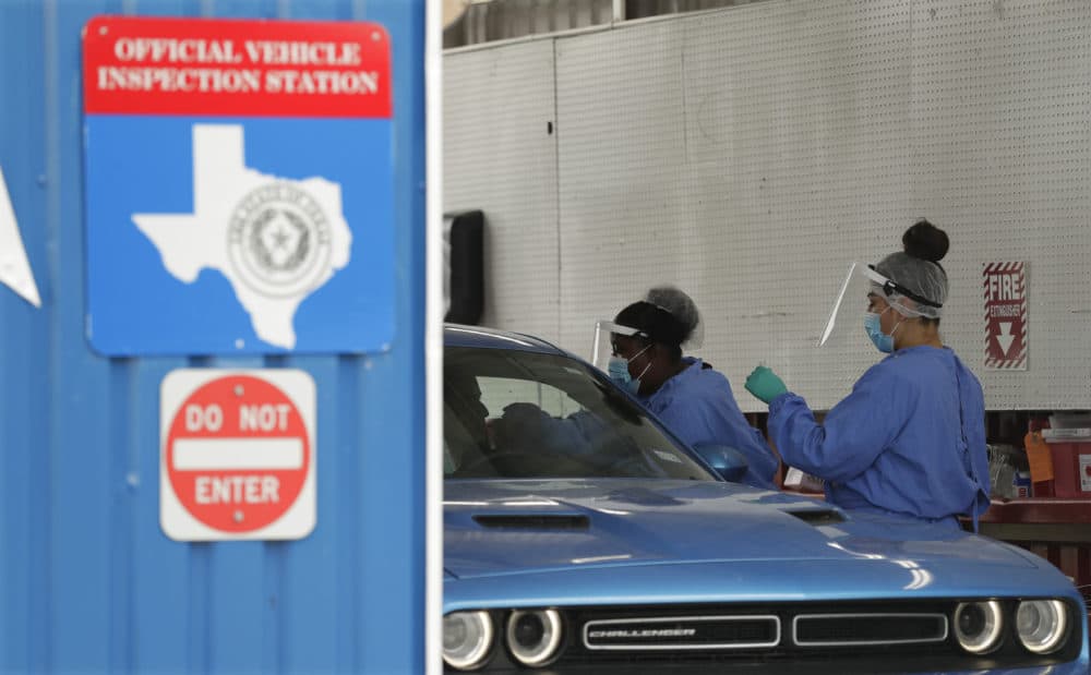 COVID-19 antibody testing and diagnostic testing are administered at a converted vehicle inspection station, Tuesday, July 7, 2020, in San Antonio. Local officials across Texas say their hospitals are becoming increasingly stretched and are in danger of becoming overrun as cases of the coronavirus surge. (Eric Gay/AP Photo)