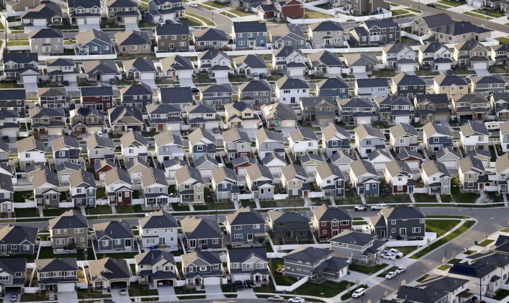President Donald Trump’s pledge to rollback an Obama-era effort to eliminate racial disparities in America’s suburbs is drawing harsh criticism from fair housing advocates, who call it a blatant attempt at racial politics and an appeal to white votes before the November election. In this 2019 file photo, rows of homes are pictured in suburban Salt Lake City. (Rick Bowmer/AP)