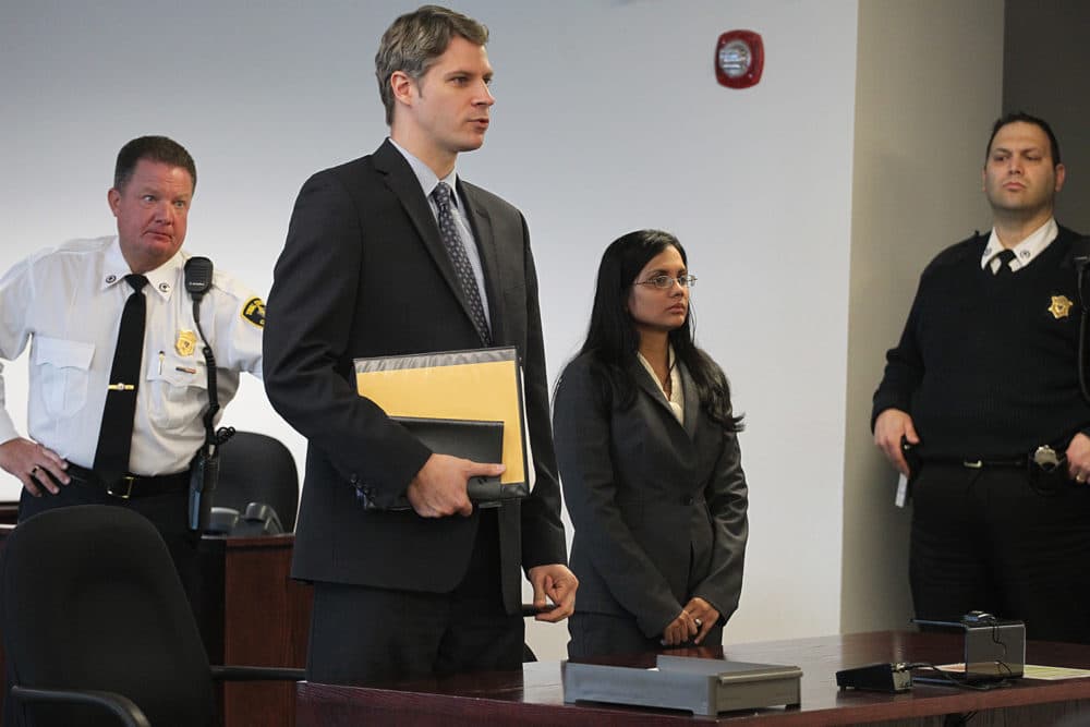 Former state lab chemist Annie Dookhan, second from right, stands in Middlesex Superior Court for arraignment on Wednesday, Jan. 9, 2013, with her attorney Nick Gordon, second left, in Woburn, Mass. Dookhan pleaded not guilty to three counts of obstruction of justice. (Suzanne Kreiter/AP Pool Photo via The Boston Globe)