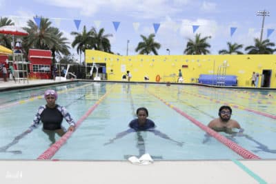 G Wright Muir (center) with her son and Niki Lopez at the Fort Lauderdale Swim-In for Restorative Justice. (David I Muir)