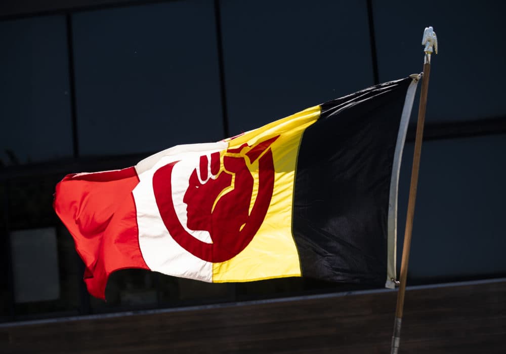 The flag of the American Indian Movement flies outside the American Indian Center during a demonstration on June 7, 2020 in Minneapolis, Minnesota. The protest, led by Native Lives Matter to honor George Floyd, drove from North Minneapolis to the American Indian Center then continued to the memorial site where Floyd was killed. (Stephen Maturen/Getty Images)