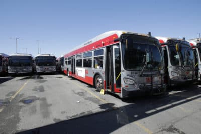 Muni buses are shown at a San Francisco Municipal Transportation Agency yard in San Francisco, Tuesday, April 7, 2020. (Jeff Chiu/AP)