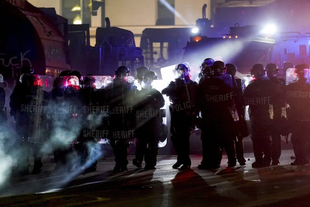 Authorities disperse protesters out of a park Tuesday, Aug. 25, 2020 in Kenosha, Wis. Anger over the Sunday shooting of Jacob Blake, a Black man, by police spilled into the streets for a third night. (Morry Gash/AP)
