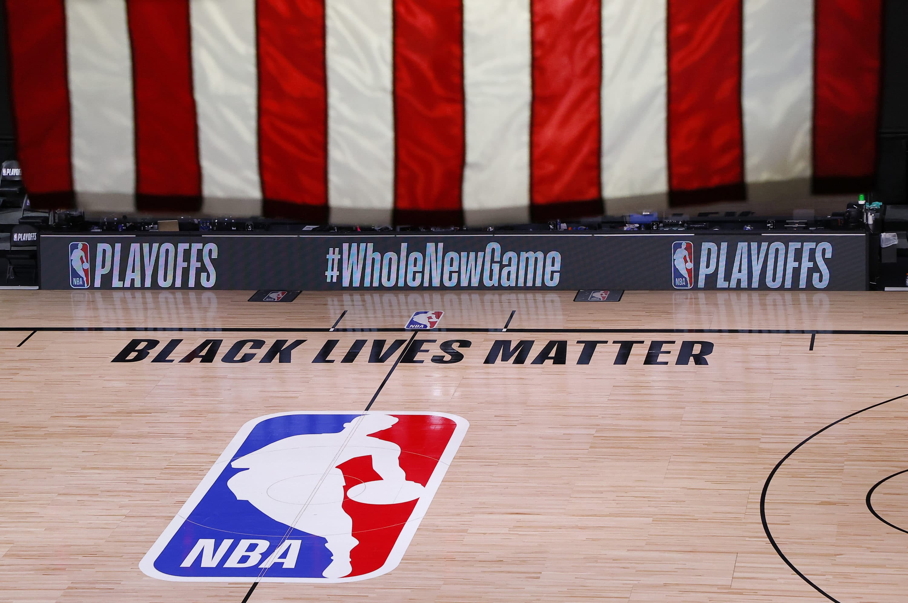 An empty court and bench are shown following the scheduled start time of Game 5 of an NBA basketball first-round playoff series, Wednesday, Aug. 26, 2020, in Lake Buena Vista, Fla. (Kevin C. Cox/Pool Photo via AP)