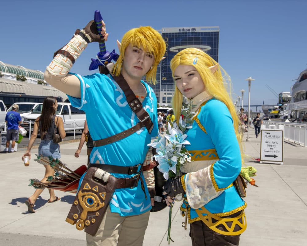 Christian Capuccino, left, dressed as &quot;Link&quot; and Dayna Austin dressed as &quot;Zelda,&quot; pose on Day Two at Comic-Con International on Friday, July 19, 2019, in San Diego, Calif. (Photo by Christy Radecic/Invision/AP)