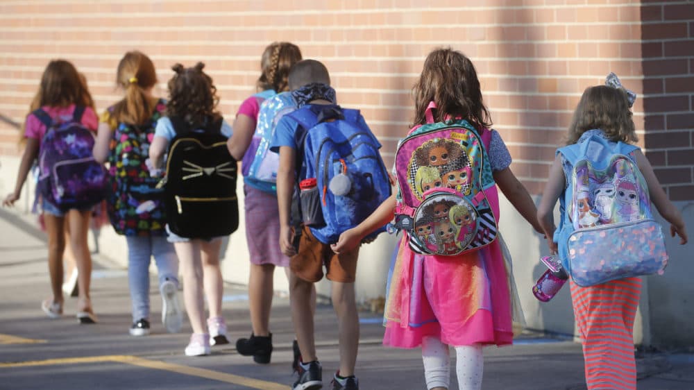 Students walk into Liberty Elementary School during the first day of class Monday, Aug. 17, 2020, in Murray, Utah. (Rick Bowmer/AP)