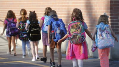 Students walk into Liberty Elementary School during the first day of class Monday, Aug. 17, 2020, in Murray, Utah. (Rick Bowmer/AP)