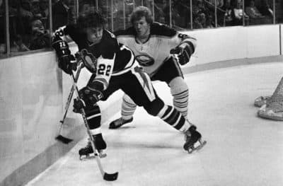 Pittsburgh Penguins forward Brian Spencer (22) races for the puck behind the net in 1977. (AP)