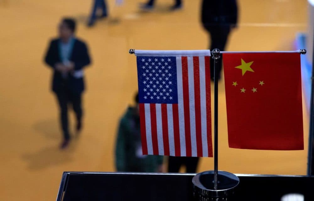 This picture taken on Nov. 6, 2018 shows a Chinese and U.S. flag at a booth during the first China International Import Expo in Shanghai. (Johannes Eisele/AFP/Getty Images)