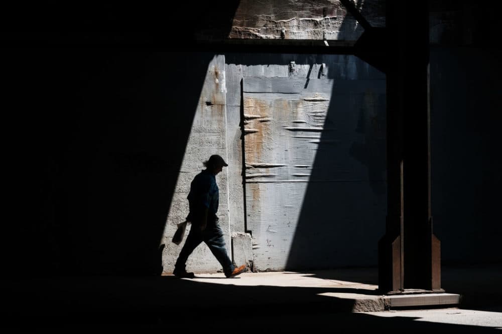 A man walks along a street in Lawrence on August 16, 2019. (Spencer Platt/Getty Images)