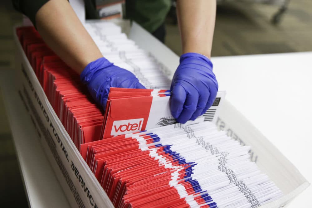 Election workers sort vote-by-mail ballots for the presidential primary at King County Elections in Renton, Washington on March 10, 2020. (Jason Redmond/AFP via Getty Images)