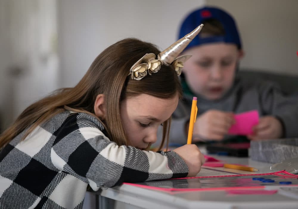 Nola Eaton, 6, and her brother Cam, 9, take part in home schooling on March 18, 2020 in New Rochelle, New York. (John Moore/Getty Images)