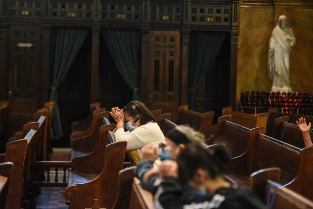 People pray inside of St. Michael's Church on May 26, 2020 in Brooklyn. (Stephanie Keith/Getty Images)