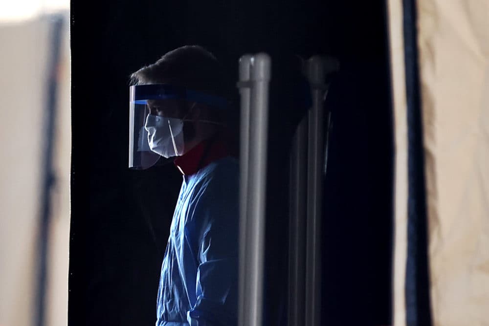 Healthcare professionals prepare to screen people for the coronavirus at a testing site (Chip Somodevilla/Getty Images)