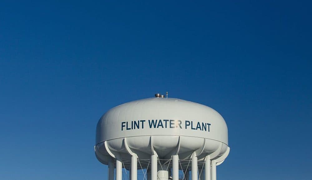 The water tower at the Flint Water Plant in Flint, Michigan, looms large over the city on March 4, 2016, nearly two years after the start of the city's water crisis. (Geoff Robins/AFP/Getty Images)
