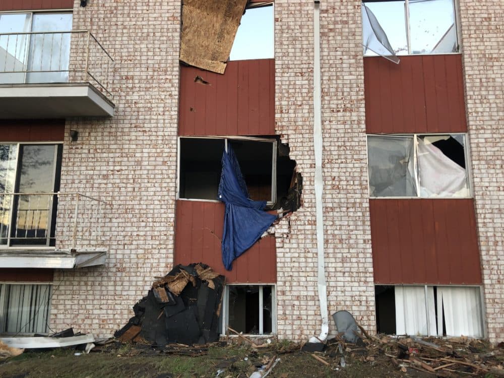 Broken windows in a damaged apartment building in Iowa after the derecho in 2020. (Kate Payne/Iowa Public Radio)
