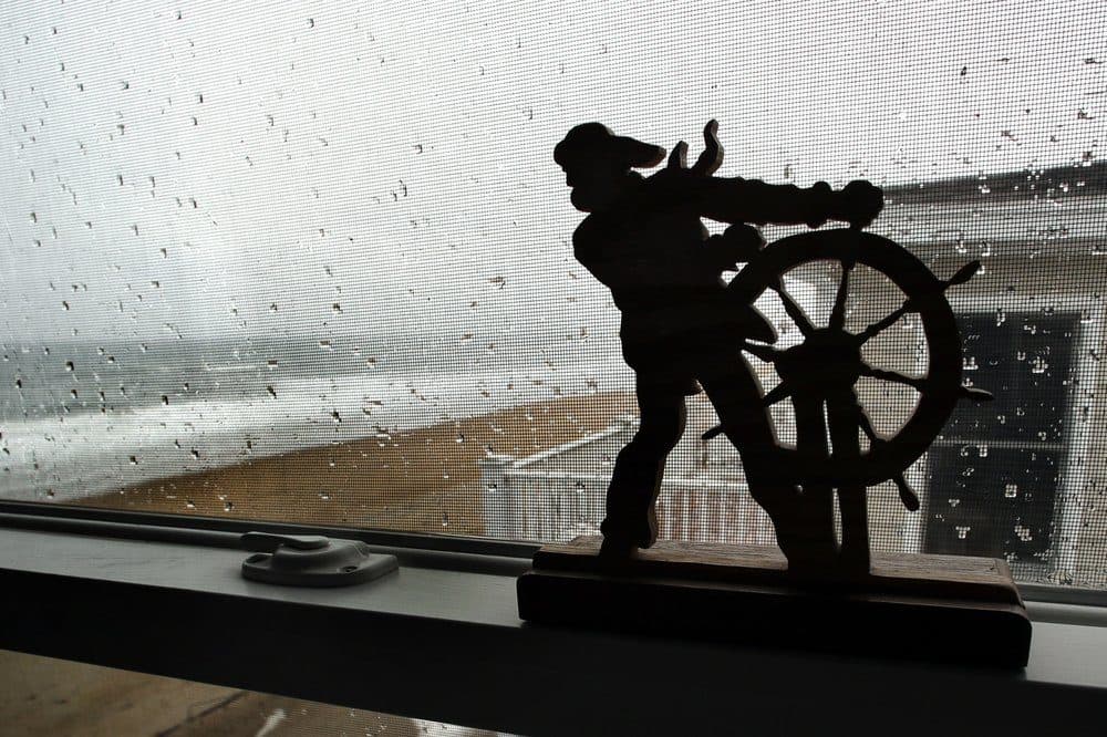 In this Feb. 15, 2019, file photo, the Atlantic Ocean surf washes up on the beach outside the window of an oceanfront condo in Salisbury, Massachusetts. (Elise Amendola/AP)