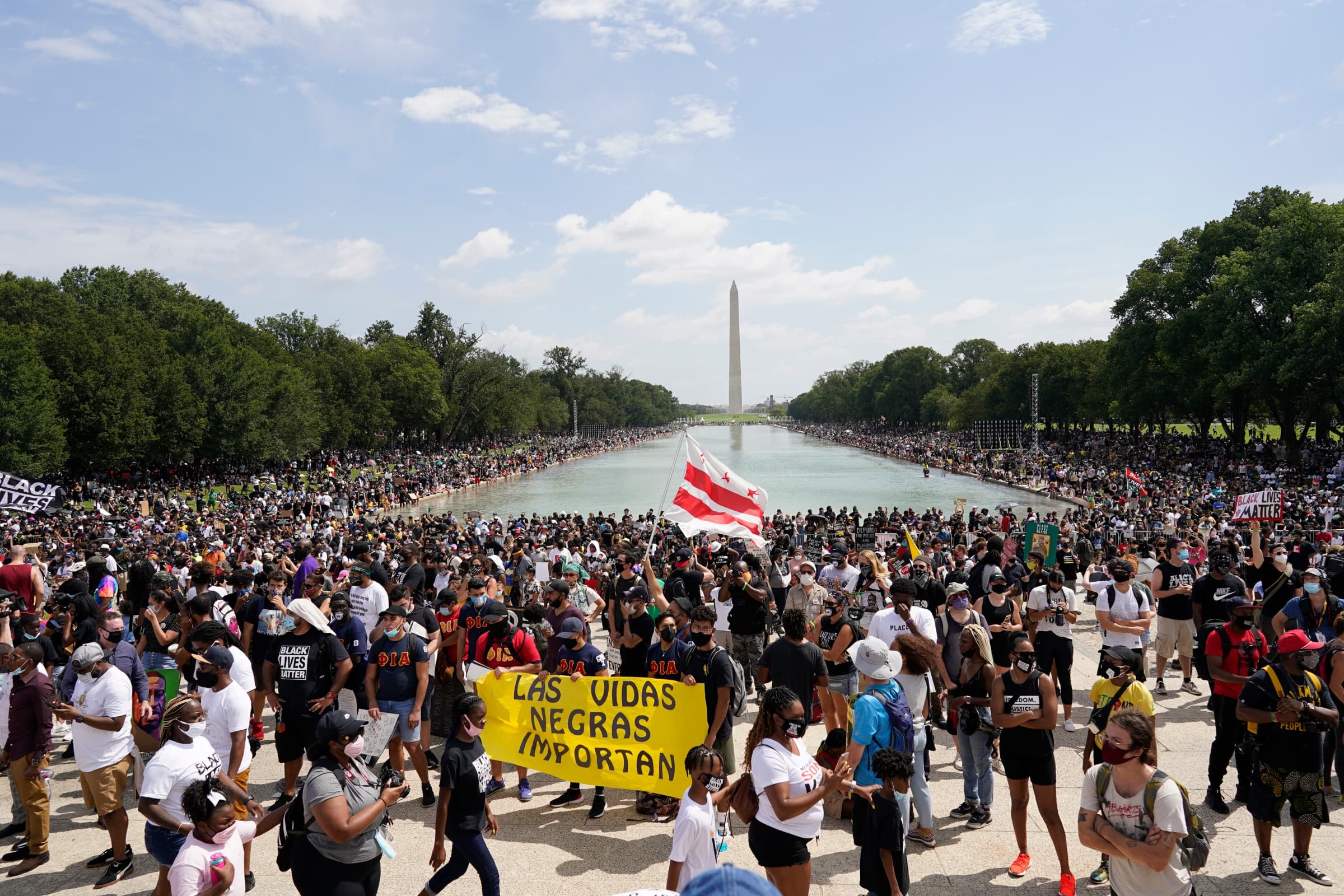 People attend the March on Washington on Friday Aug. 28, 2020, in Washington, on the 57th anniversary of the Rev. Martin Luther King Jr.’s “I Have A Dream” speech. (Carolyn Kaster/AP)