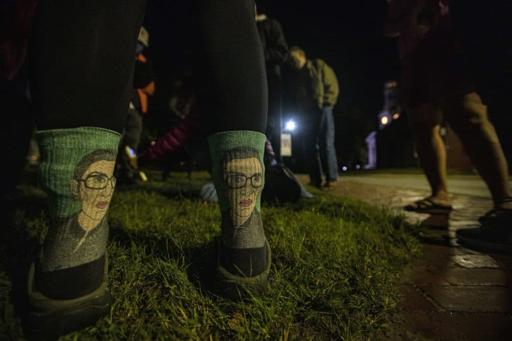 Kate Kavanaugh wore her Ruth Bader Ginsburg socks to to the vigil at Monument Square in Concord to pay respects after her death. (Jesse Costa/WBUR)