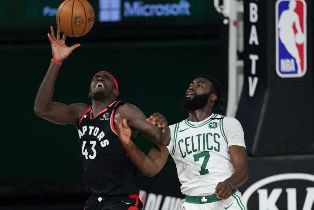 Toronto Raptors' Pascal Siakam catches a pass in front of Boston Celtics' Jaylen Brown during the second half of an NBA conference semifinal playoff basketball game Saturday, Sept. 5, 2020, in Lake Buena Vista, Florida. (Mark J. Terrill/AP)