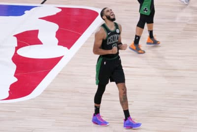 Boston Celtics' Jayson Tatum celebrates after his team defeated the Toronto Raptors during an NBA conference semifinal playoff basketball game on Friday, Sept. 11, 2020, in Lake Buena Vista, Florida. (Mark J. Terrill/AP)