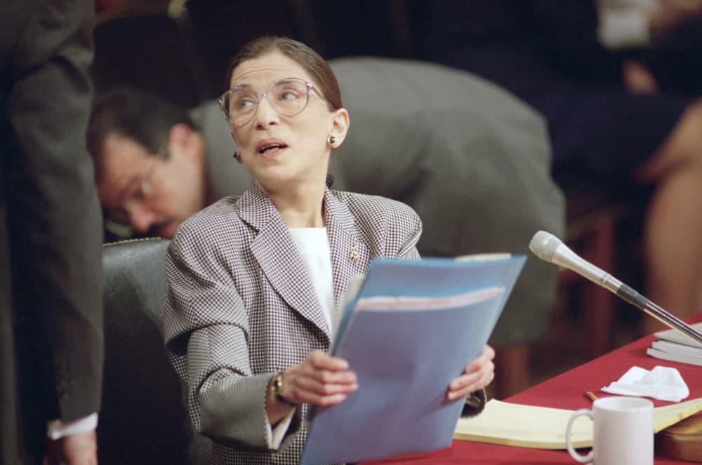 Supreme Court nominee Judge Ruth Bader Ginsburg gathers her papers at the lunch break of her confirmation hearing before the Senate Judiciary Committee on Capitol Hill on Thursday, July 22, 1993 in Washington. (Charles Tasnadi/AP Photo)