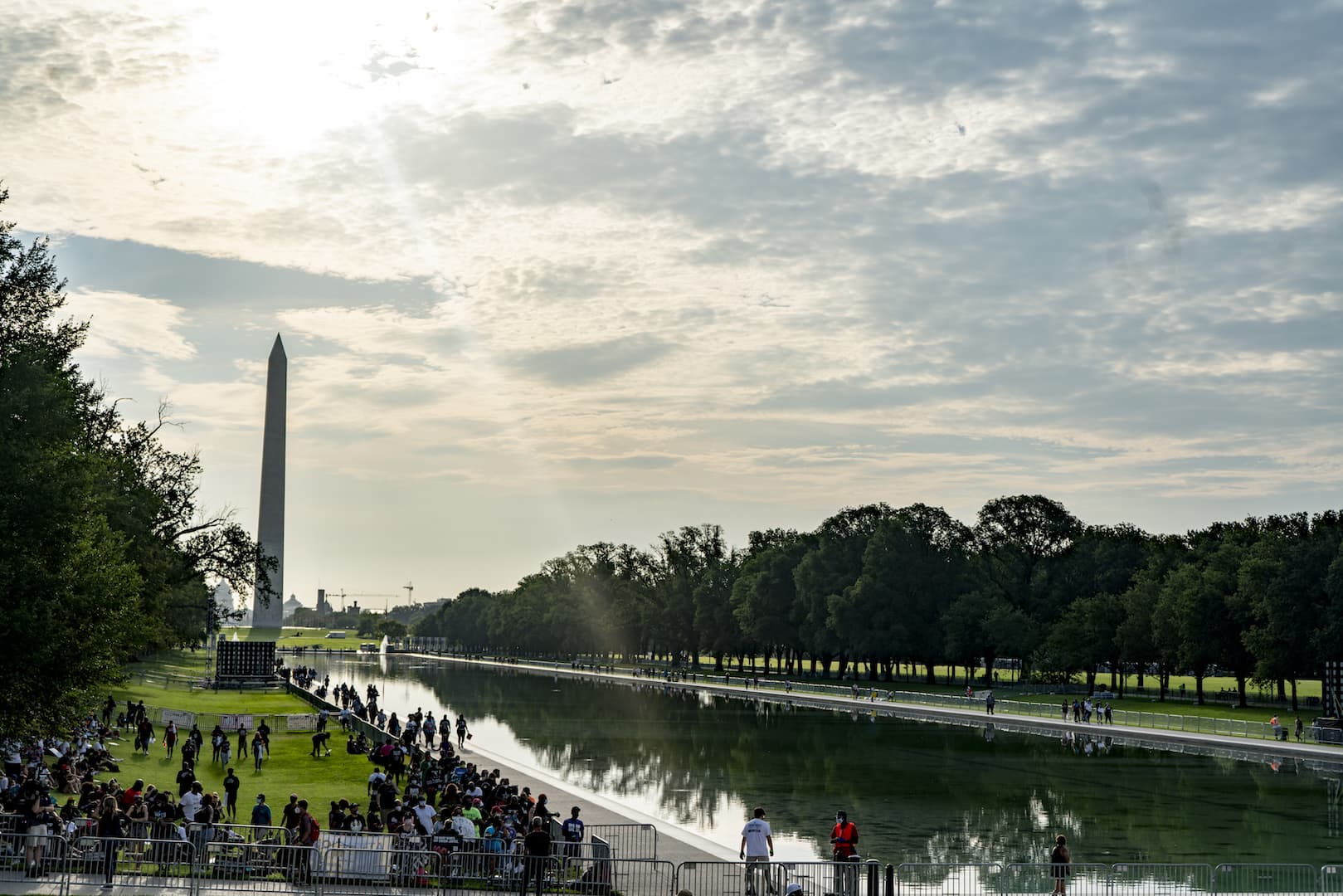 The early morning sun kisses the reflecting pool as lines begin to form for the March on Washington. (OJ Slaughter for WBUR)