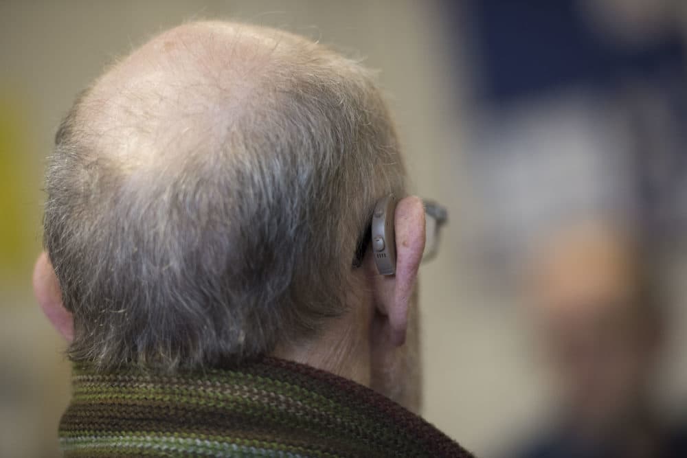 A man wears a hearing aid in this 2015 photo. (Matthew Horwood/Getty Images)