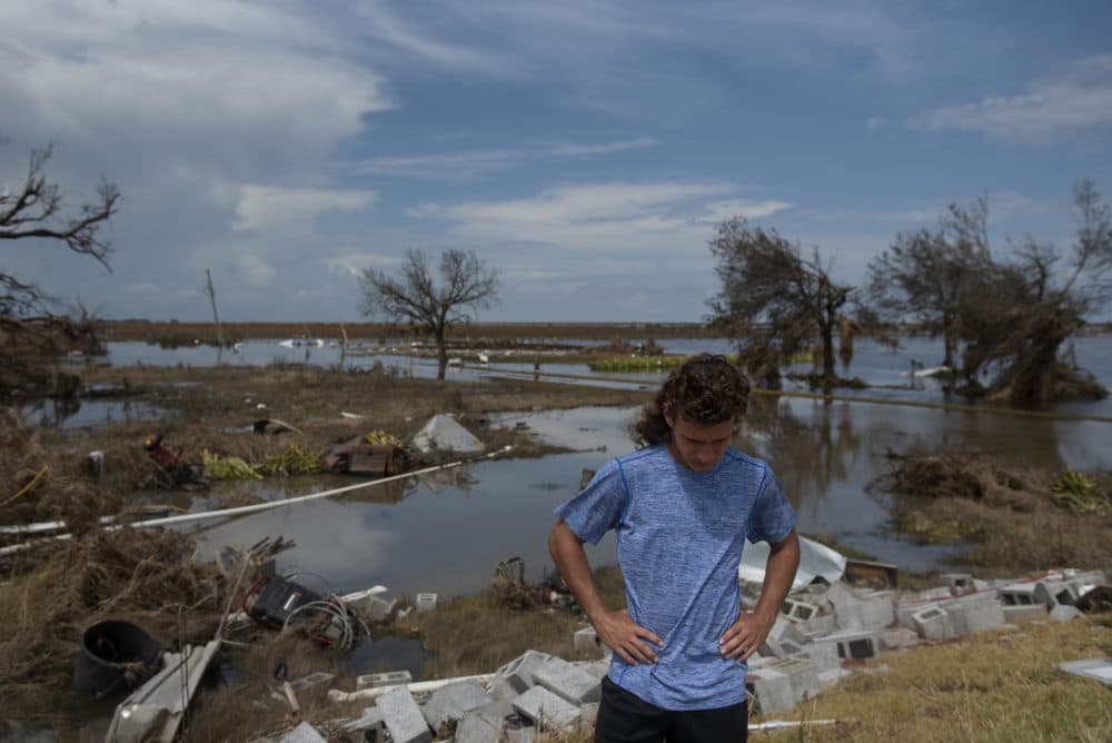 Connor Theriot, 16, has an emotional moment while standing on the slab of foundation that once held his family's home after Hurricane Laura  landed along the Texas-Louisiana border in Cameron, Louisiana on August 30, 2020. (Callaghan OHare/Washington Post via Getty Images)