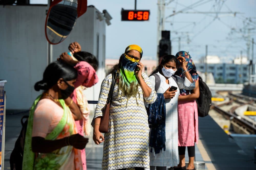 Passengers waits for a train following the resumption of metro services after more than five months of shutdown due to the Covid-19 coronavirus pandemic, at a station in Hyderabad on September 7, 2020.(NOAH SEELAM/AFP via Getty Images)