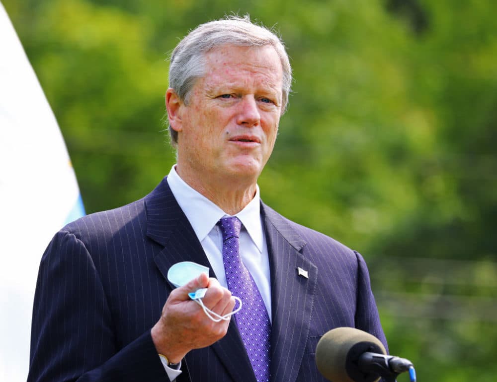 Gov. Charlie Baker points to the effectiveness of wearing face masks during a press conference on Sept. 15, 2020. (Pat Greenhouse/The Boston Globe via Getty Images)