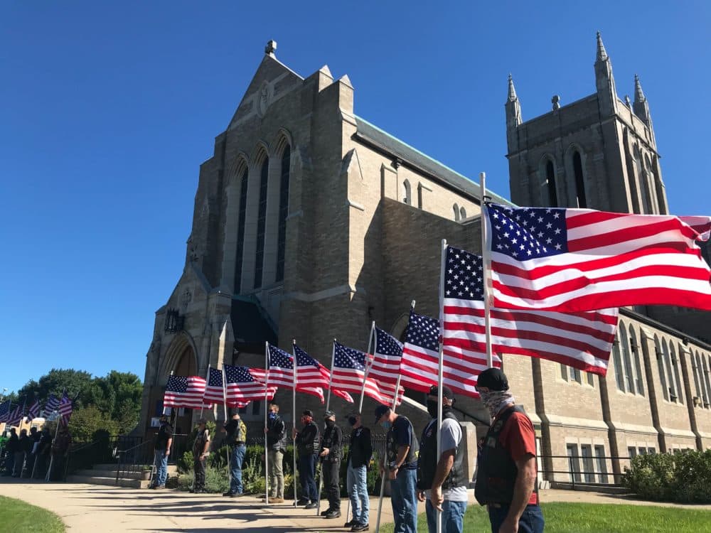 About 20 men from the Patriot Guard Riders stood vigil outside the funeral of Army Sgt. Elder Fernandes in Brockton Saturday morning. (Quincy Walters/WBUR)