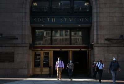 Commuters depart South Station in Boston, MA on July 14, 2020. (Photo by Craig F. Walker/The Boston Globe via Getty Images)