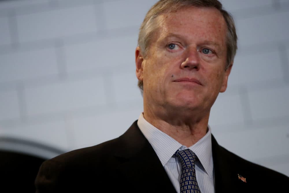 Gov. Charlie Baker takes questions from the media at Mill City BBQ and Brew in Lowell, Mass. on Sept. 23, 2020. (Craig F. Walker/Globe Staff via pool)