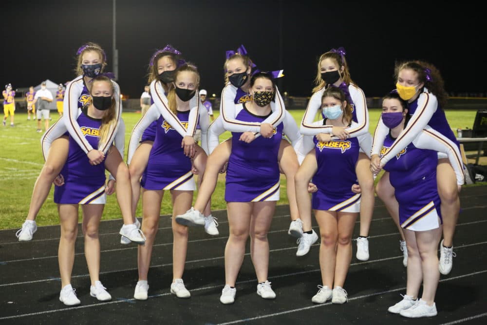 Cheerleaders wear masks at a socially distant high school football game in Clinton County, Iowa. (Scott Hoag Photography)