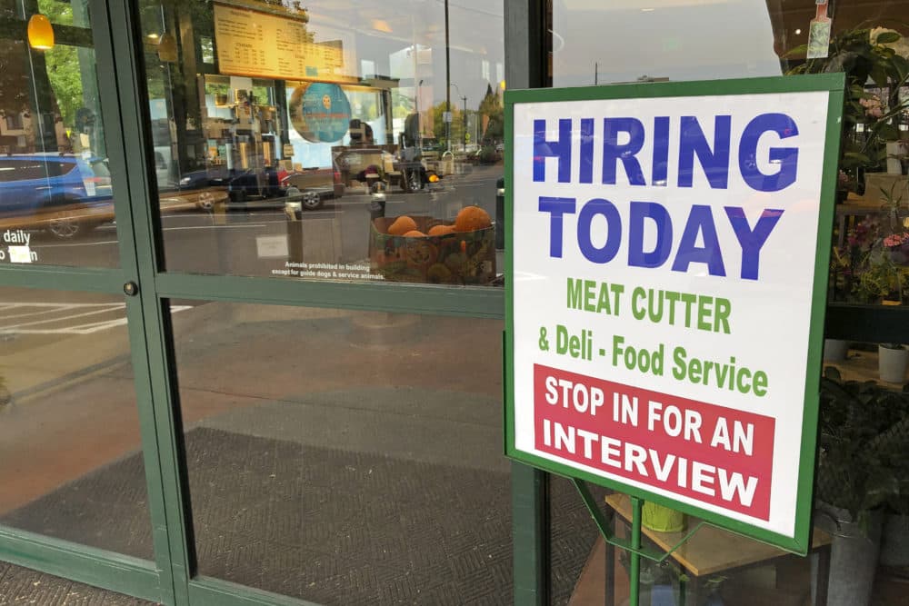 A sign that reads &quot;hiring today,&quot; is shown at a grocery store in Olympia, Wash., advertising a job opportunity for a meat cutter on Oct. 3, 2020. (Ted S. Warren/AP)