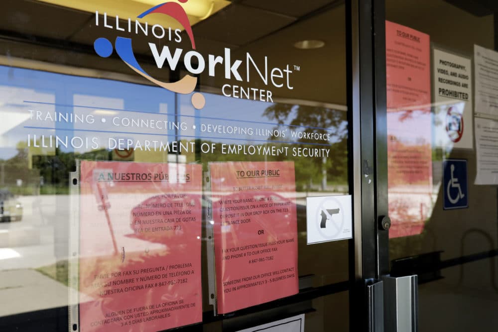 In this June 11, 2020, file photo, information signs are displayed at the closed Illinois Department of Employment Security WorkNet center in Arlington Heights, Ill. U.S. employers advertised for slightly fewer jobs in August while their hiring ticked up modestly. (Nam Y. Huh/AP File)