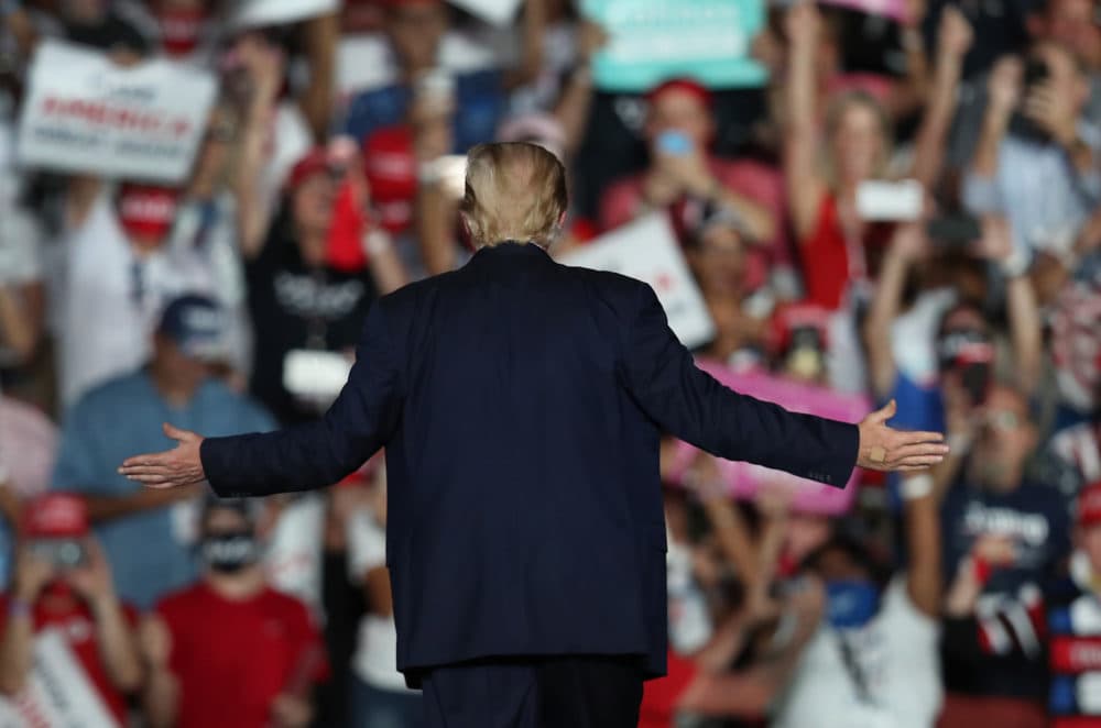 President Donald Trump waves to the crowd as he leaves after speaking during a campaign event at the Orlando Sanford International Airport on October 12, 2020 in Sanford, Florida. (Joe Raedle/Getty Images)