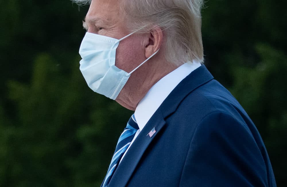 President Donald Trump leaves Walter Reed Medical Center in Bethesda, Maryland heading towards Marine One on October 5, 2020, to return to the White House after being discharged. (Photo by SAUL LOEB/AFP via Getty Images)