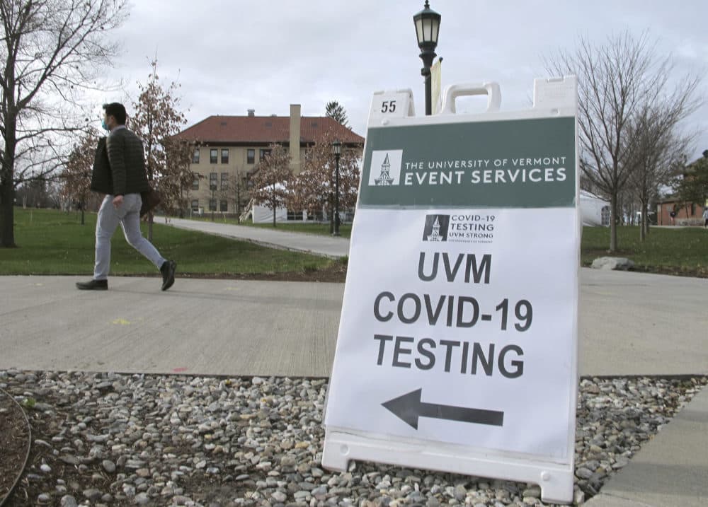 A University of Vermont student walks toward a tent leading to a COVID-testing site on campus in Burlington, Vt. on Nov. 12, 2020. (Lisa Rathke/AP)