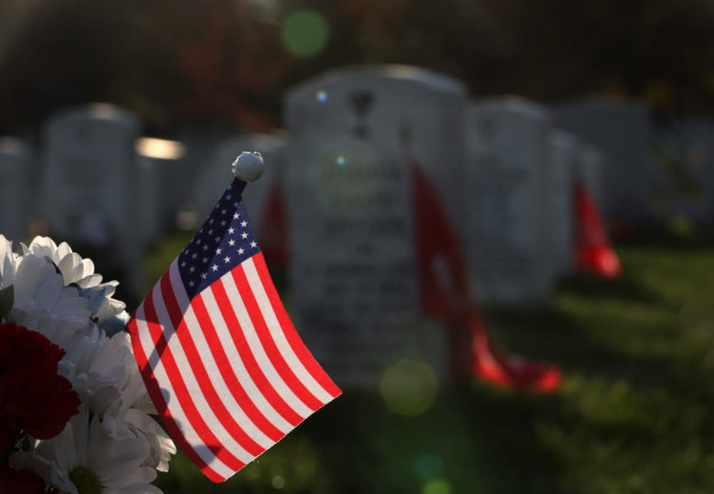 An American flag adorns a grave site at Section 60 at Arlington National Cemetery on Veterans Day Nov. 11, 2019 in Arlington, Virginia. Americans observed Veterans Day to honor those who had served in the U.S. military. (Alex Wong/Getty Images)