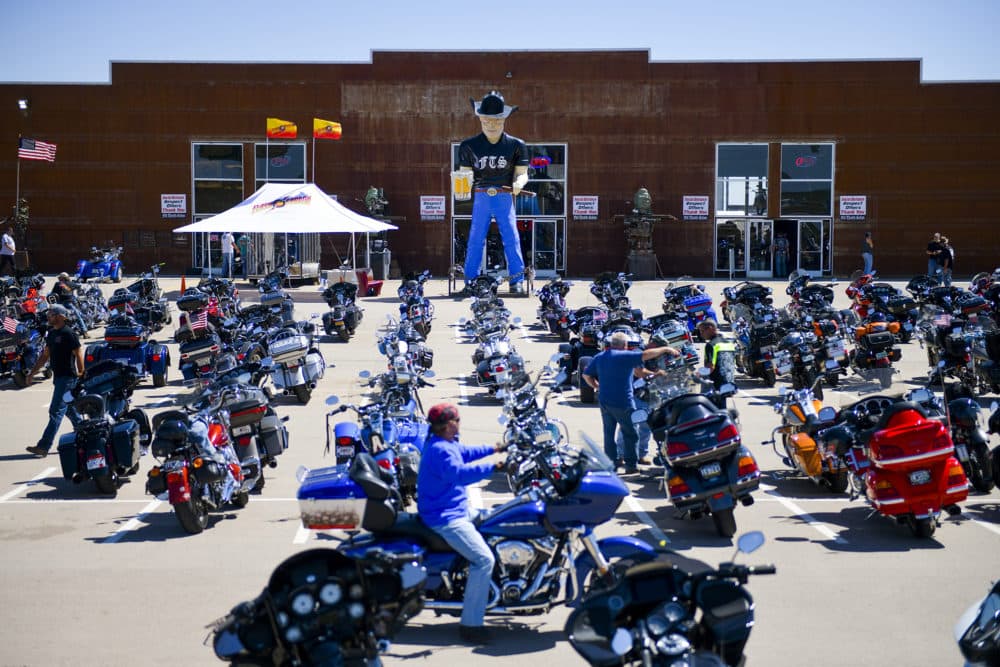 STURGIS, SD - AUGUST 09: A motorcycle rider looks for parking outside the Full Throttle Saloon during the 80th Annual Sturgis Motorcycle Rally in Sturgis, South Dakota on August 9, 2020. While the rally usually attracts around 500,000 people, officials estimate that more than 250,000 people may still show up to this year's festival despite the coronavirus pandemic. (Michael Ciaglo/Getty Images)