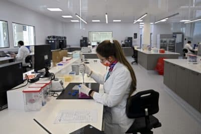 Scientists work at the mAbxience biosimilar monoclonal antibody laboratory plant in Garin, Buenos Aires province, on August 14, 2020, where an experimental coronavirus vaccine will be produced for Latin America. - Argentina will manufacture while Mexico will pack and distribute in Latin America, except of Brazil, the vaccine against COVID-19 developed by the University of Oxford and the AstraZeneca laboratory. (Juan Mabromata/AFP via Getty Images)