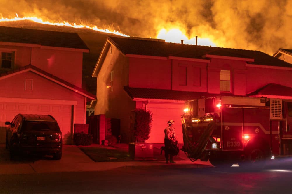 Flames come close to houses during the Blue Ridge Fire on October 27, 2020 in Chino Hills, California. (David McNew/Getty Images)