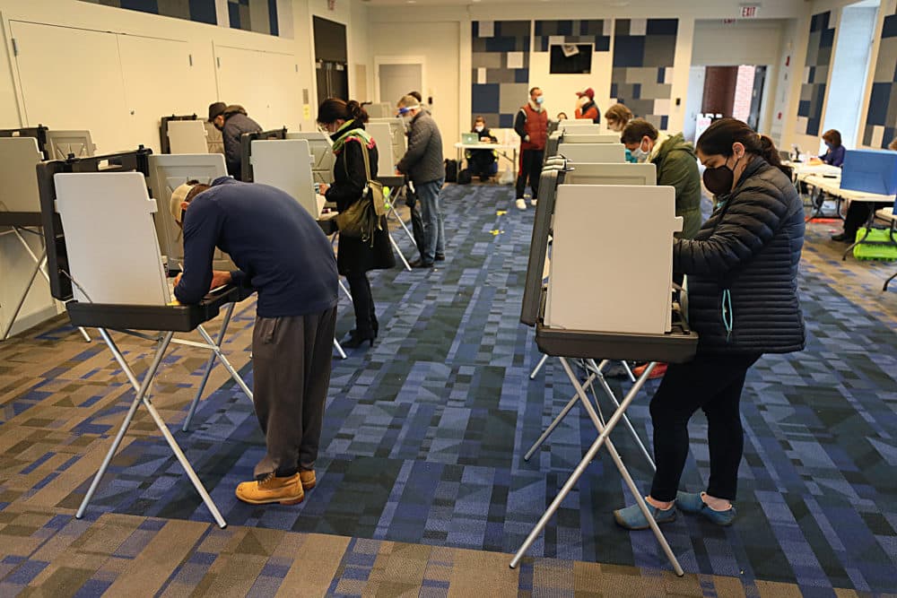 Early voting at the Newton Free Library for early in-person voting on Oct. 28. (Suzanne Kreiter/The Boston Globe via Getty Images)