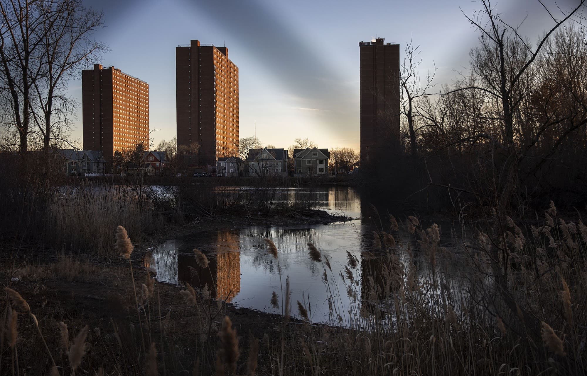 Rindge Towers on a winter evening seen from across Jerry's Pond. (Robin Lubbock/WBUR)
